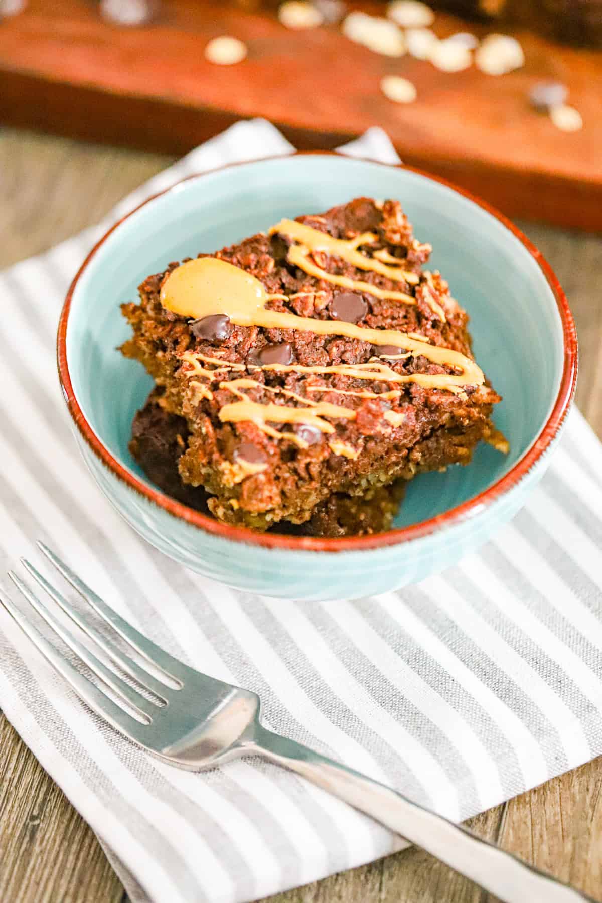 Ingredients for brownie baked oatmeal recipe including oats, cocoa powder, and chocolate chips