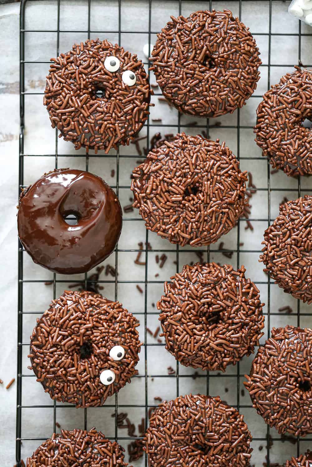 Fun Chocolate Sprinkle Donuts on a baking rack