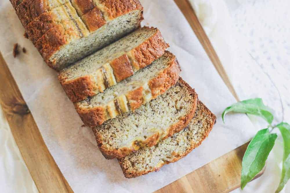 Sour Cream Banana Bread recipe on a cutting board