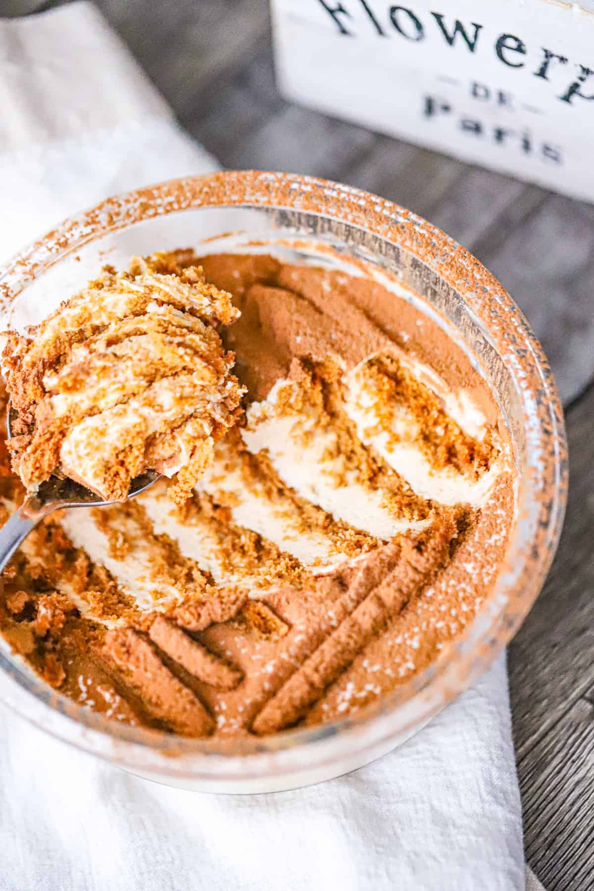 Japanese yogurt cheesecake in a glass jar with cookie layers visible